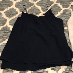 Two silky material tanks